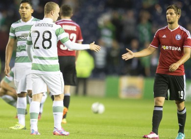 Legia Warsaw's Bartosz Bereszynski (right) shakes hands with Celtic's Leigh Griffiths after the final whistle.