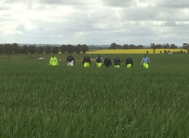 Police searching the property.