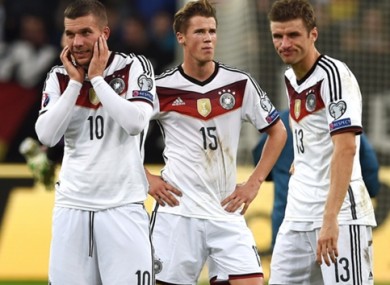 Podolski and his Germany teammates after the late Irish equaliser.