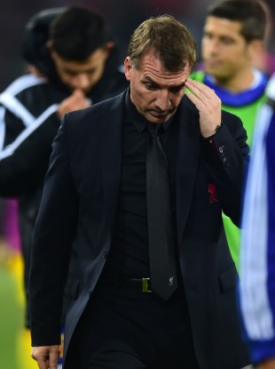 Liverpool's Brendan Rogers walks off at the end of the Basel game.