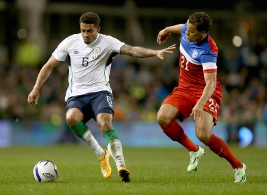 Cyrus Christie of Ireland with Timmy Chandler of USA.