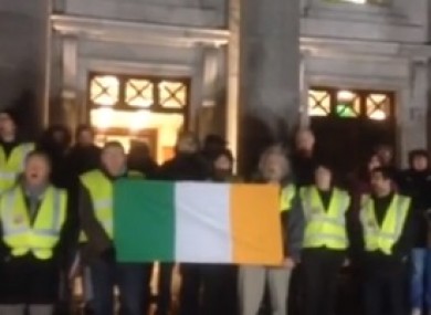 Protesters outside the council meeting this evening.