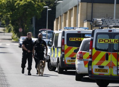 Police and a dog outside Dixons Kings Academy.