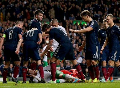 Scotland's players surround Richard Keogh during Ireland's November defeat in Glasgow.