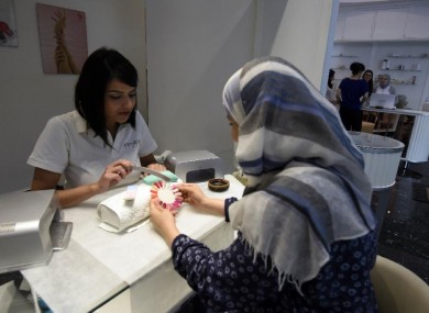 An Algerian woman gets a manicure at Algiers' Bab Ezzouar mall.