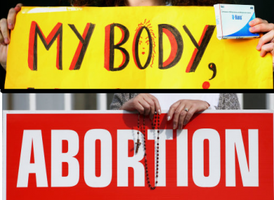 Two signs at a pro-life and pro-choice march.