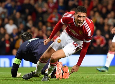 Manchester United's Chris Smalling celebrates scoring his side's second goal during the UEFA Champions League Group B match at Old Trafford, Manchester.