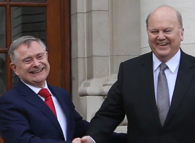 Ministers Howlin and Noonan outside Government Buildings yesterday