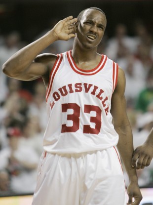 In this March 1, 2009, file photo, then-Louisville's Andre McGee pretends to have trouble hearing the cheers of fans after scoring during the second half of their NCAA college basketball game