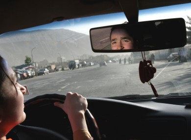 Sofia Ziaee drives her father's car in downtown Kabul, Afghanistan.