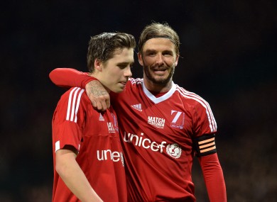 Beckham and his son Brooklyn, who came on as a late substitute.