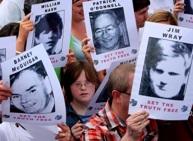 Crowd carry pictures of the victims of Bloody Sunday as the report of the Saville Inquiry was released.