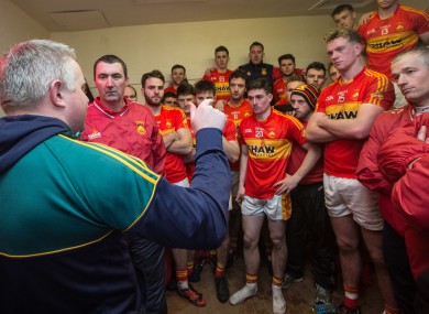 Stephen Rochford congratulates Castlebar Mitchels in their victorious dressing room yesterday.