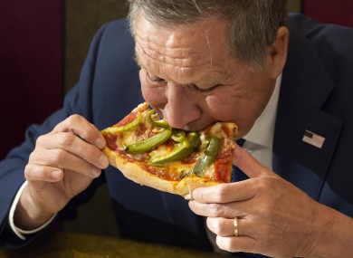 Kasich eats pizza at Gino's Pizzeria in Queens, New York last week.