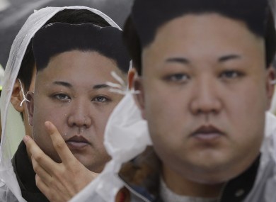 North Korean defectors wearing Kim Jong-un masks at a protest in Seoul, South Korea