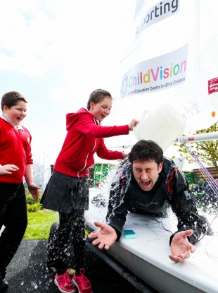 Evan O’Dwyer and Ellen Drewitt from St Joseph's Primary School at ChildVision, Drumcondra pictured with Gary ‘Ted’ Sargent wet at the launch of the One Wild Ride.