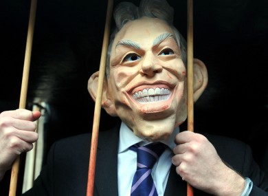 A protester in a Tony Blair mask as the former Prime Minister gave evidence before the inquiry.