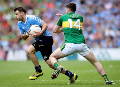 Dublin's Kevin McManamon and Paul Geaney of Kerry compete for the ball.