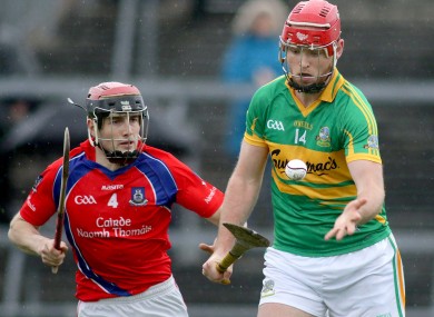 Gort's Michael Mullins with Cathal Burke of St. Thomas.