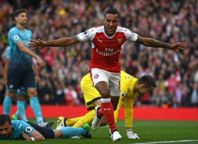 Arsenal forward Theo Walcott celebrates scoring against Swansea City.