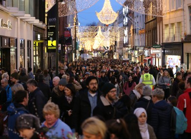 Crowds shop under last year's Grafton Street lights.