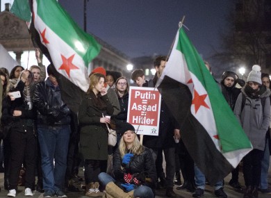 People in London come together in a candle vigil at Trafalgar Square, central London, to condemn the killings of civilians in Aleppo, Syria.