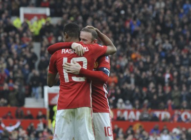 The man to beat: Rashford and Rooney celebrate after the FA Cup win over Reading.