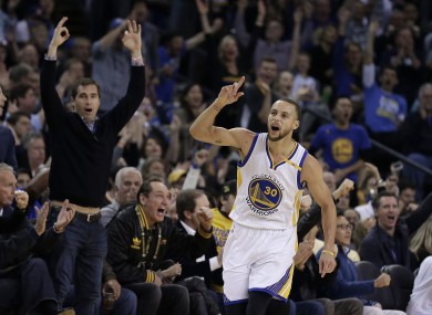 Steph Curry celebrates scoring during the first half.