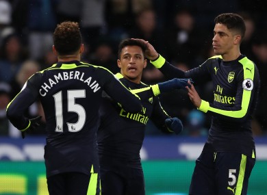 Arsenal's Alexis Sanchez (centre) celebrates scoring his side's fourth goal of the game.