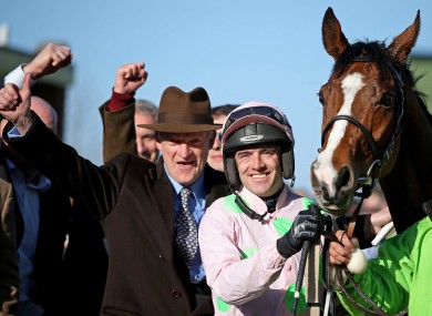 Jockey Ruby Walsh celebrates Faugheen's 2015 Champion Hurdle success with winning trainer Willie Mullins.