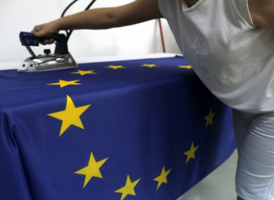 A seamstress works on an EU flag in Belgrade.