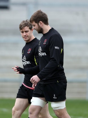 Ulster's record try-scorer shows off his new glove to Iain Henderson.