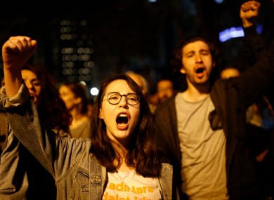 Supporters of No vote chant slogans as they protest against the referendum outcome, in Istanbul early today