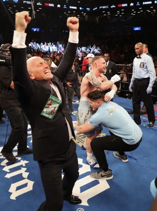 Barry and Shane McGuigan celebrate with Carl Frampton after his win over Leo Santa Cruz.