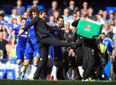Chelsea manager Antonio Conte reacts after a soaking after the Premier League match at Stamford Bridge.