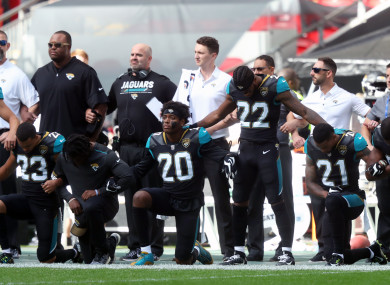 Jacksonville Jaguars players kneel in protest during the national anthem before the NFL International Series match at Wembley Stadium, London.