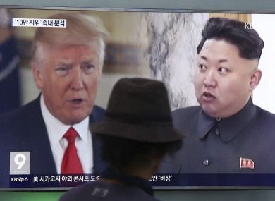 File photo of a man watches a TV screen showing a local news programme reporting about North Korea's missiles.