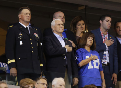 Vice President Mike Pence stands during the playing of the national anthem before an NFL football game.