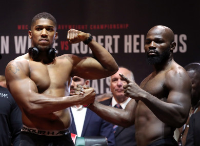 Anthony Joshua (left) and Carlos Takam during the weigh-in at Motorpoint Arena Cardiff.