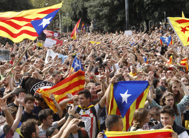 Catalan independists gathered Playa de Catalunya in Barcelona, Spain, yesterday to celebrate the result of the referendum.
