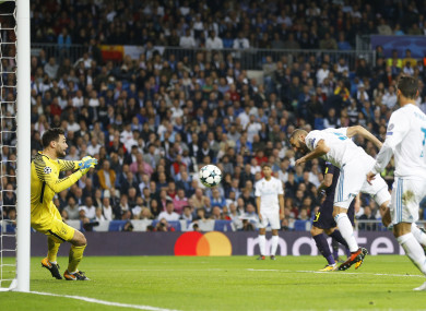 Real Madrid's Karim Benzema, second right, looses an opportunity to score against Tottenham goalkeeper Hugo Lloris.