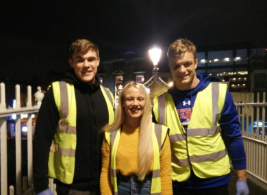 Garry Ringrose and Josh van der Flier with Natasha Morgan of Feed Our Homeless.