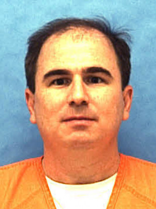 This undated photo made available by the Florida Department of Law Enforcement shows Eric Scott Branch in custody
