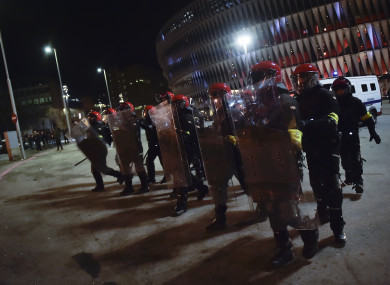 Police in riot gear outside the stadium