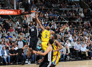 LaMarcus Aldridge dunks on an injury-ravaged Warriors side.