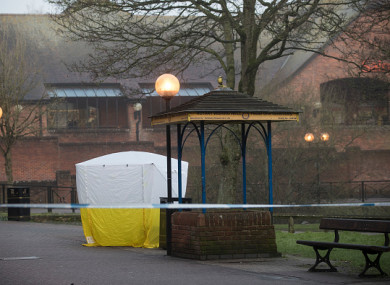 A forensic tent stands over a bench in Salisbury where the man and woman were found unconscious