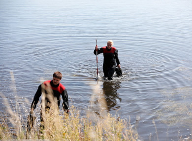Members of the Danish Emergency Management Agency assist police in the search for missing body parts last August