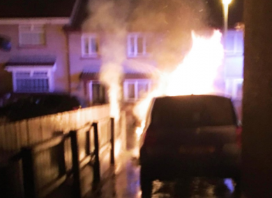 The councillor's car in flames last night.