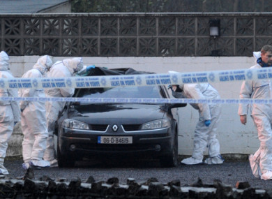 Gardai examine a car in the wake of the shooting at the Huntsman Inn in 2013.