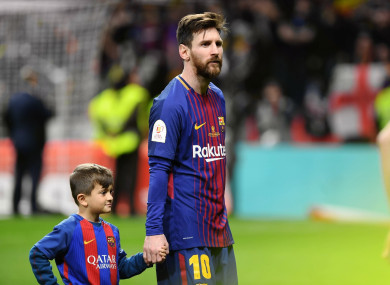 Lionel Messi accompanies his son after the Spanish King's Cup final match between FC Barcelona and Sevilla.